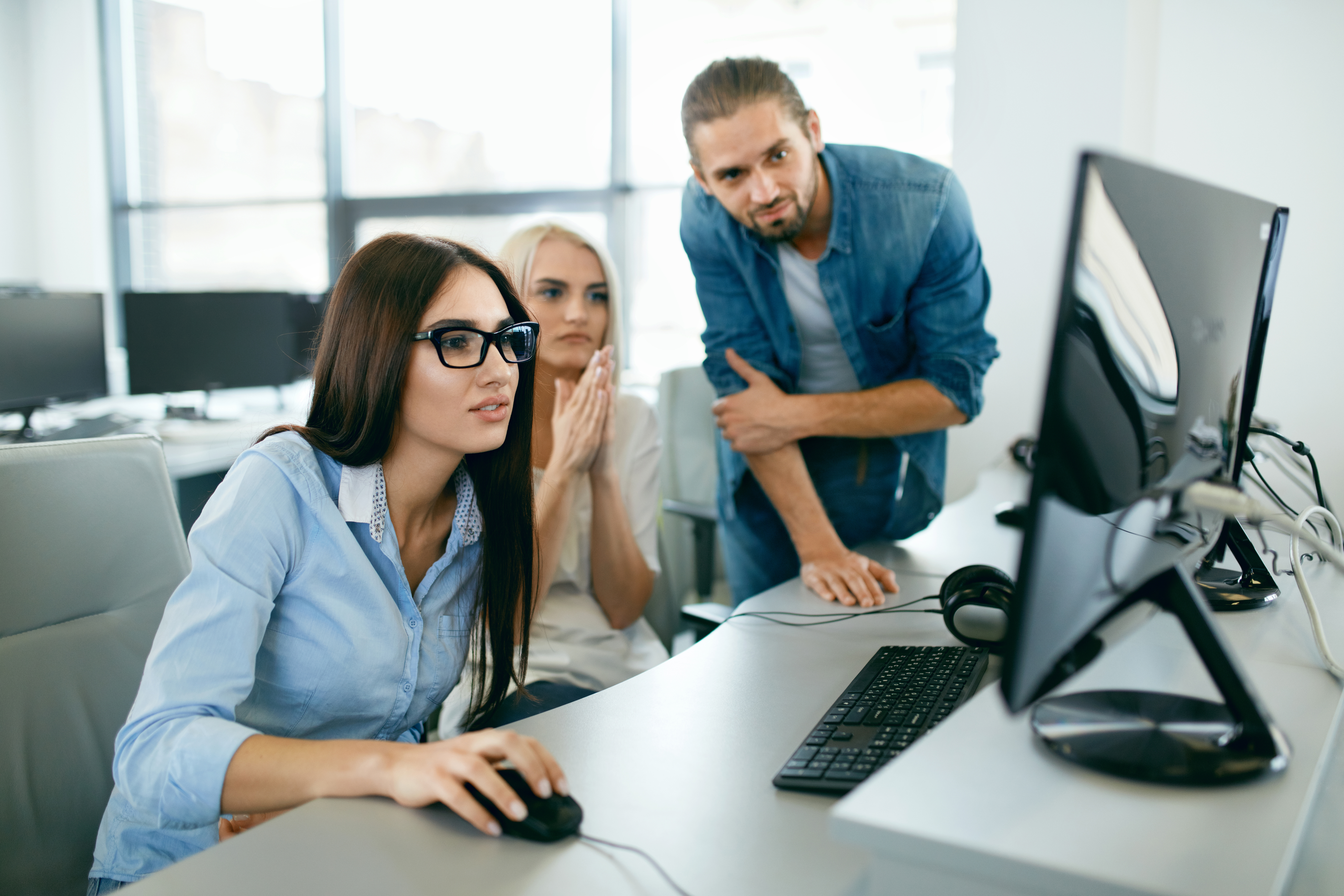 IT office. People Working At Open Workplace